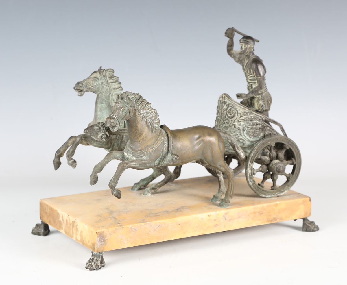 A late 19th century patinated cast bronze model depicting a Roman horse-drawn chariot above a