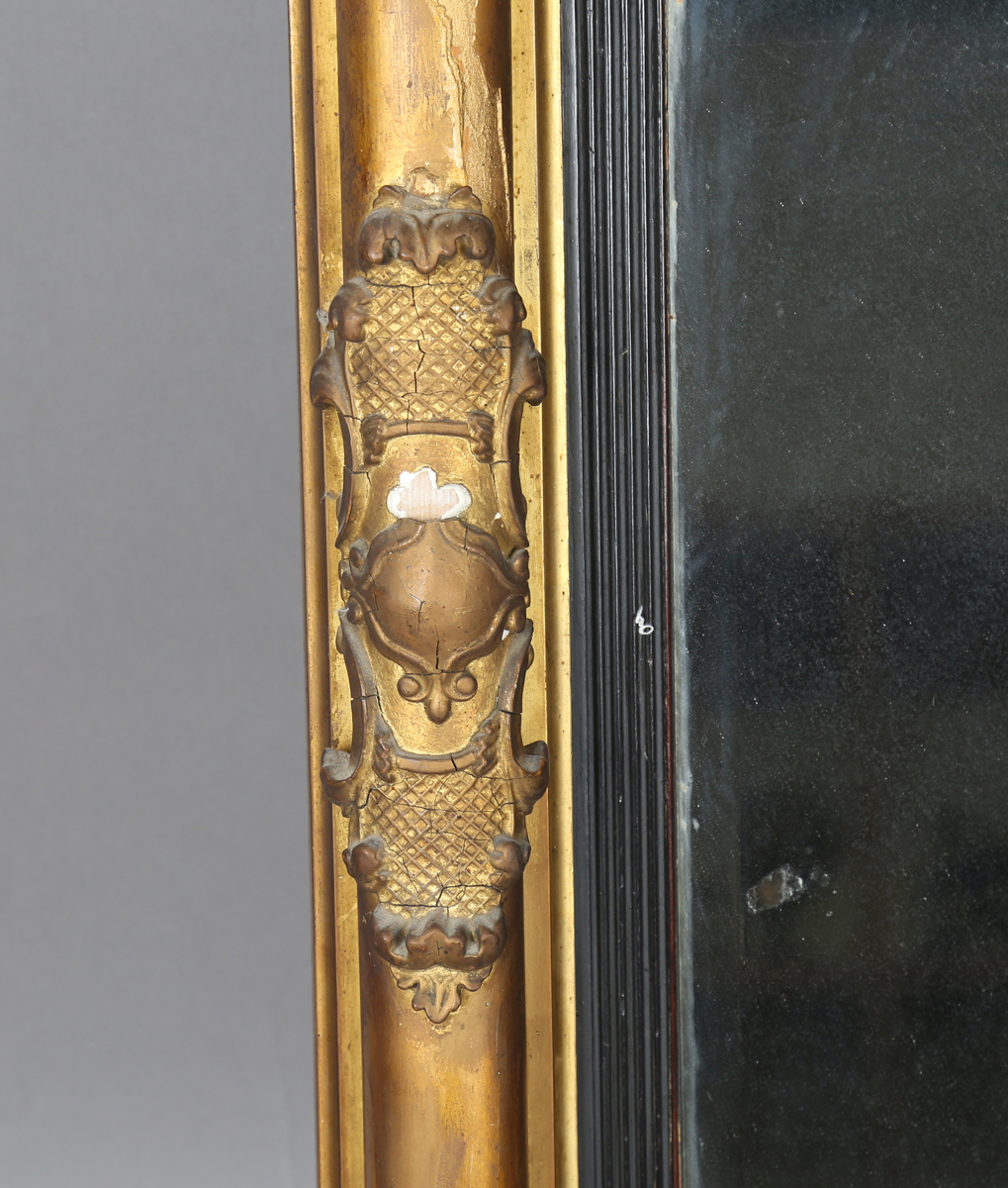 An early 19th century giltwood pier mirror with a carved foliate frieze and foliate cartouche- - Image 8 of 11