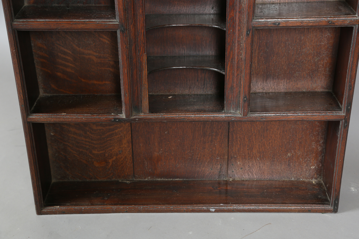 A 18th century and later provincial oak wall shelf with central arched niche, height 99cm, width - Image 3 of 5