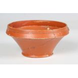 A Roman Samian ware cup, 2nd century AD, the inverted rim sprigged with opposing dolphins,