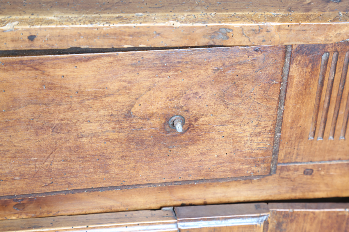 An 18th century French provincial walnut cabinet, fitted with two drawers above panelled doors, - Image 14 of 20