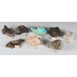 A group of large mineral specimens, including brecciated granite, banded baryte, fluorite, albite,