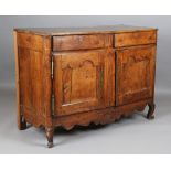 An 18th century French provincial walnut cabinet, fitted with two drawers above panelled doors,