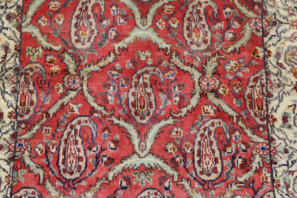 A Tabriz rug, Central Persia, mid/late 20th century, the red field with a boteh lattice, within an - Image 4 of 6