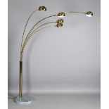 A mid-20th century Italian gilt brass five-light arc floor lamp, designed by Harvey Guzzini, the