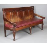A George III Lancastrian oak panel back settle, raised on cabriole legs, height 105cm, width