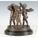 A 19th century Continental brown patinated cast bronze figure group of three musical putti, raised