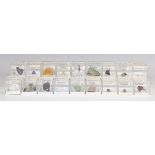 A collection of approximately 140 small mineral specimens, including cavansite, prehnite, peridot