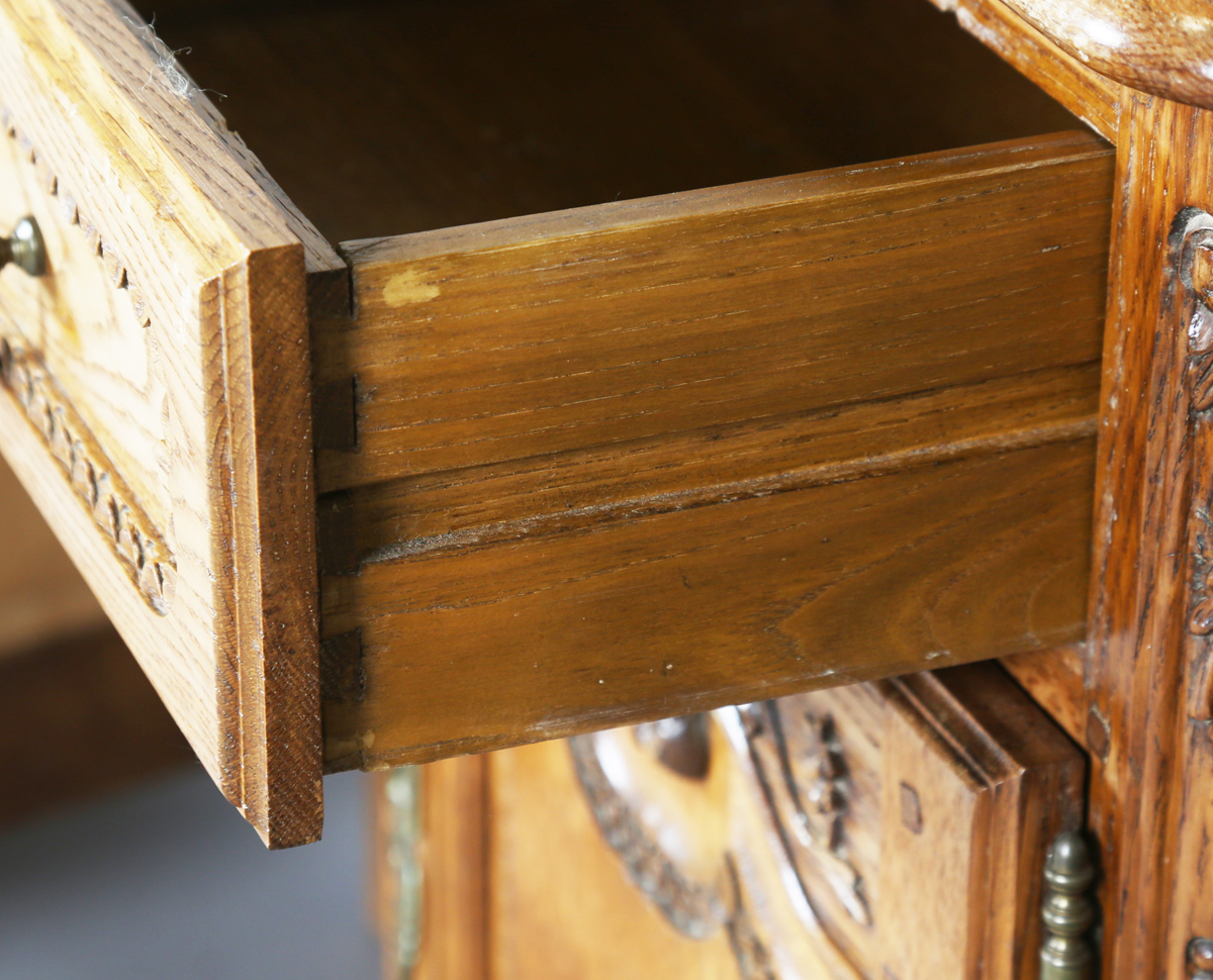 A pair of late 20th century French oak bedside cabinets, each fitted with a finely carved drawer and - Image 9 of 17