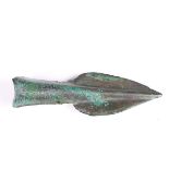 A Bronze Age socketed spearhead of ribbed leaf form, length 13cm. Provenance: Timeline Auctions