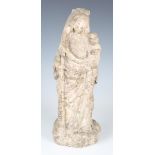 A carved stone figure group of the standing Madonna holding a crowned baby Jesus, probably