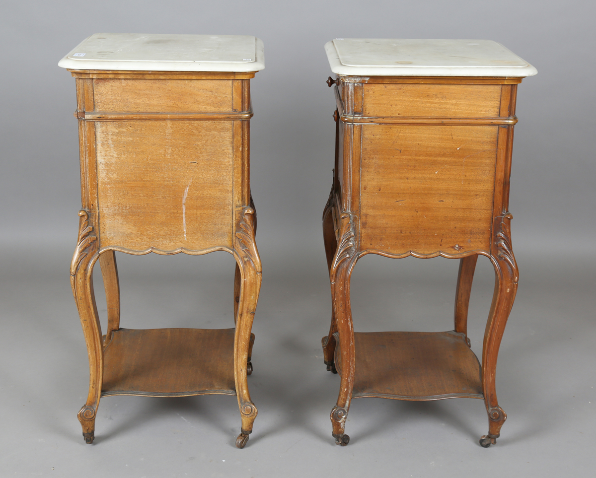 A pair of early 20th century French mahogany and white marble-topped beside cabinets, each fitted - Image 2 of 20