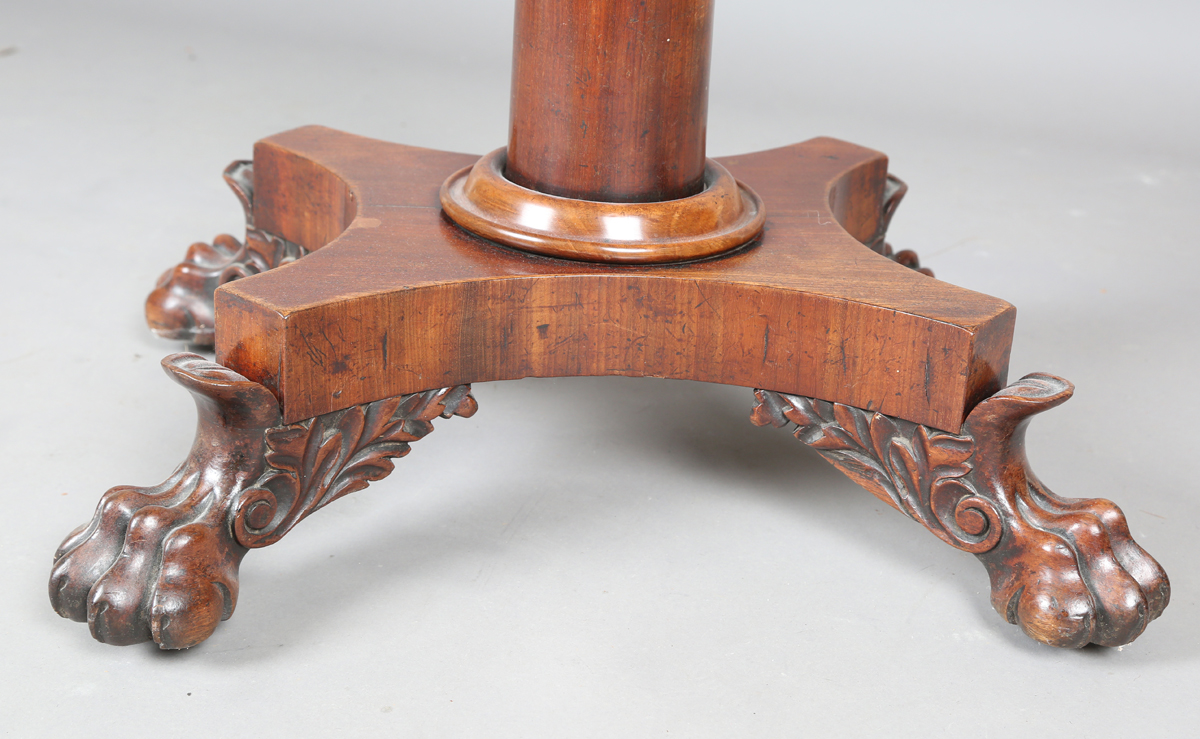 A George IV mahogany fold-over tea table, raised on a turned column and quatrefoil base, height - Image 4 of 9