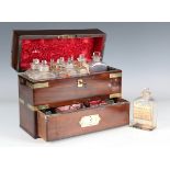A late George III mahogany and brass bound apothecary's travelling case, containing glass bottles,