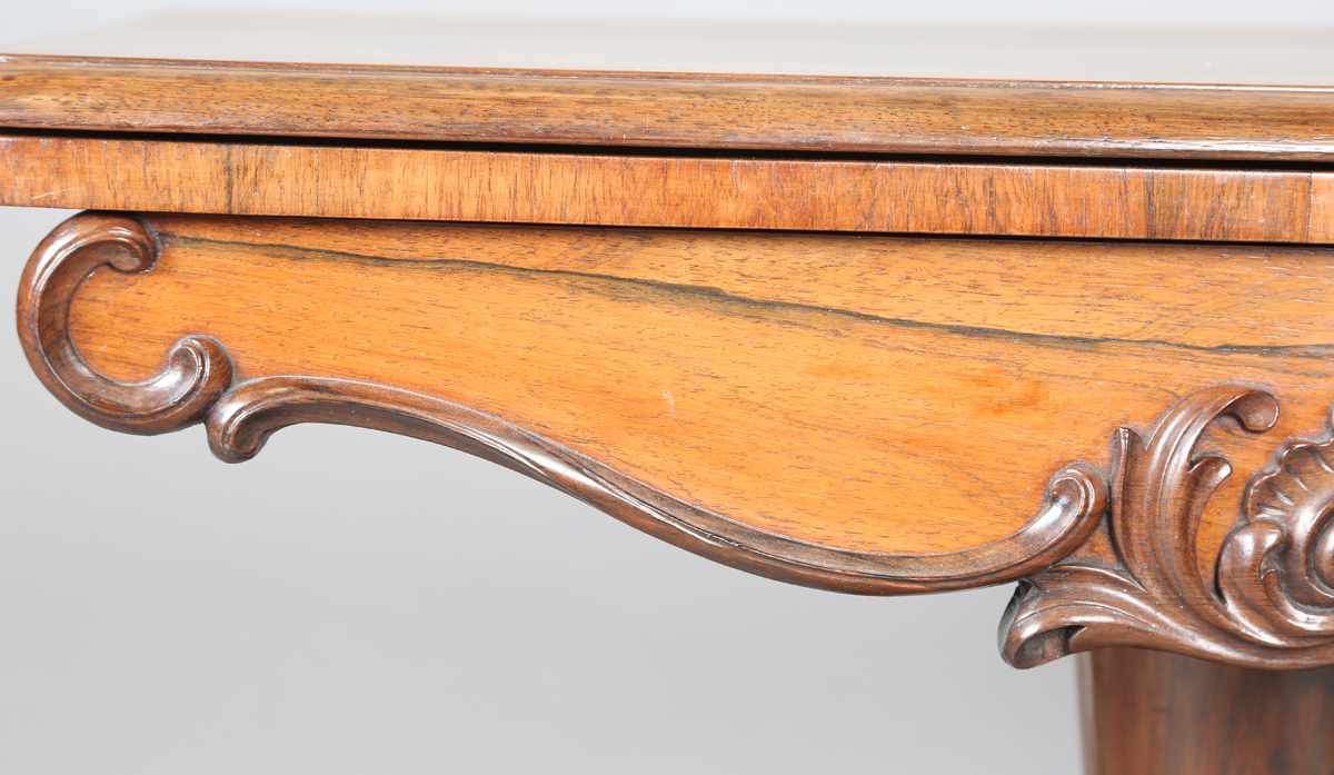 An early Victorian rosewood fold-over tea table, the frieze with applied foliate carved - Image 8 of 11