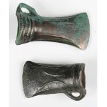 A small Bronze Age socketed axehead with linear decoration to each face and binding loop, probably