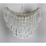 A mid-20th century Italian chromium plated and Venini crystal glass four-light chandelier of