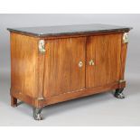An early 19th century French Empire mahogany side cabinet with black marble top and applied gilt