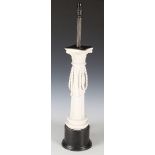 A 20th century Continental white glazed porcelain table lamp of Corinthian column form with rope-