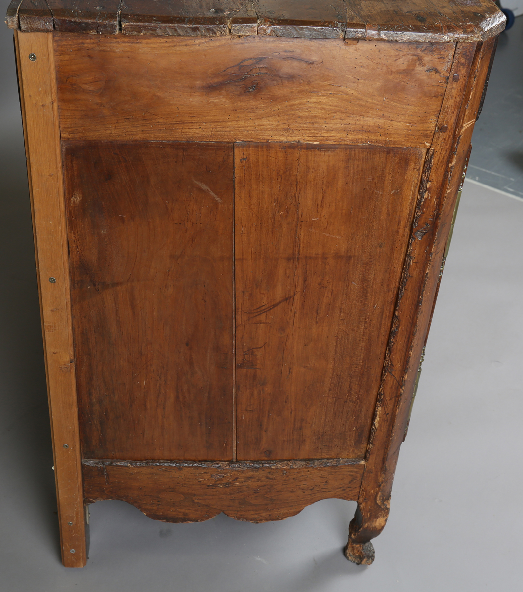 An 18th century French provincial walnut cabinet, fitted with two drawers above panelled doors, - Image 4 of 20