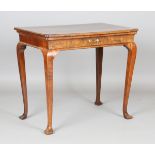 A George I and later walnut side table, the crossbanded top above a single frieze drawer, on