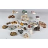 A collection of mineral specimens, including chrysolla, various calcite formations and siderite,