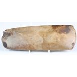 A Danish Neolithic polished stone axehead of yellow-brown flint, bearing old collection label