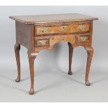 An 18th century oak side table with mahogany crossbanded borders, fitted with three drawers,