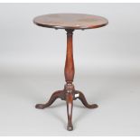 A George III mahogany circular tip-top wine table, raised on tripod legs, height 69cm, diameter