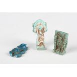 An Egyptian blue glazed faience amulet, Late Period, 664-343 BC, finely modelled as three figures