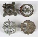 A group of four Roman plate type brooches, including a raised umbonate disc type, width 4.5cm, a