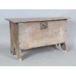 A 17th century washed oak six-plank coffer with shaped side supports, height 51cm, width 84cm, depth