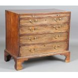 A George III mahogany chest of oak-lined drawers, fitted with a brushing slide and original gilt