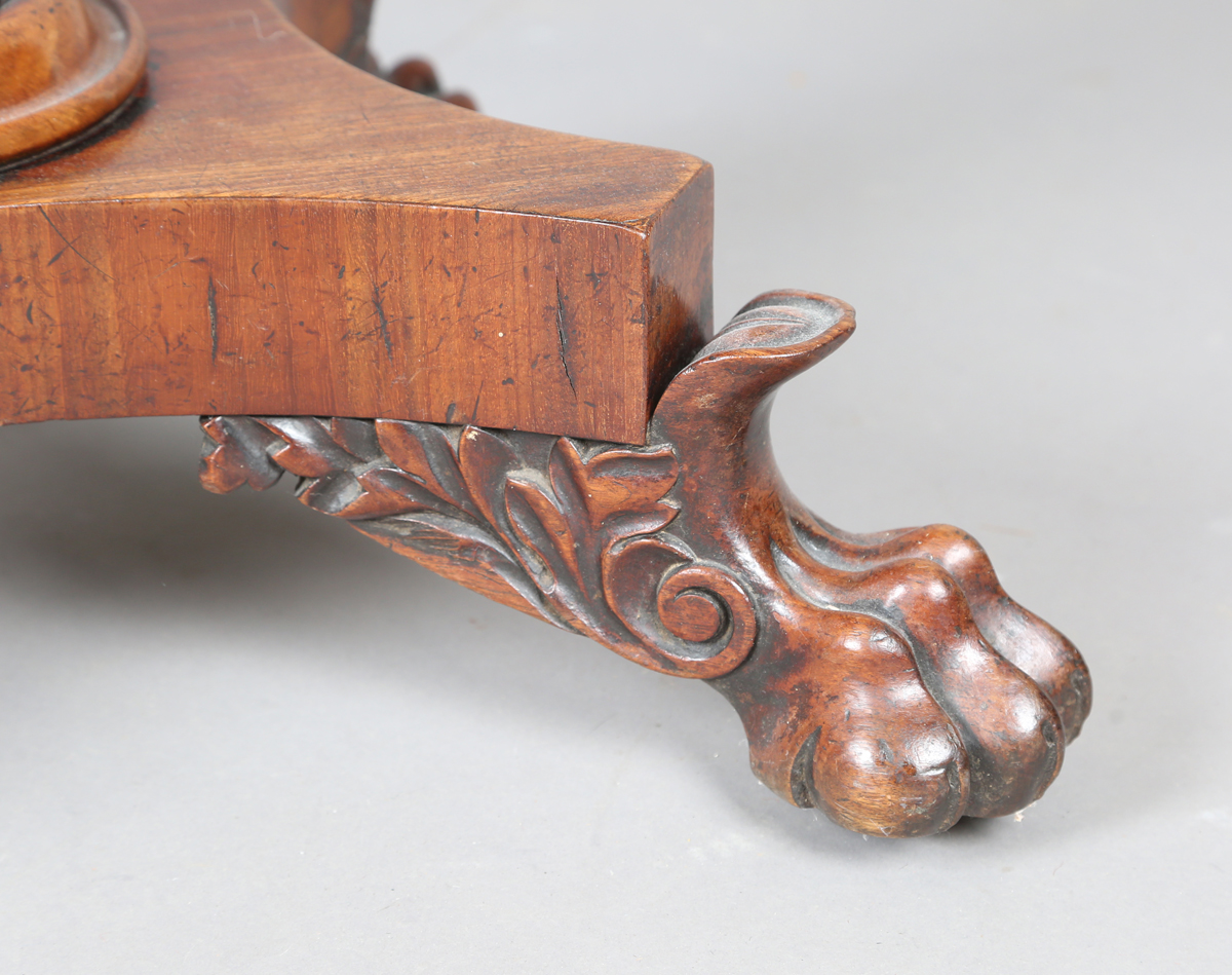 A George IV mahogany fold-over tea table, raised on a turned column and quatrefoil base, height - Image 3 of 9