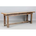 A 19th century oak refectory table, made from some earlier elements, the single-plank top on