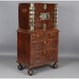 A William and Mary burr wood and brass mounted collector's cabinet, raised on an associated chest of