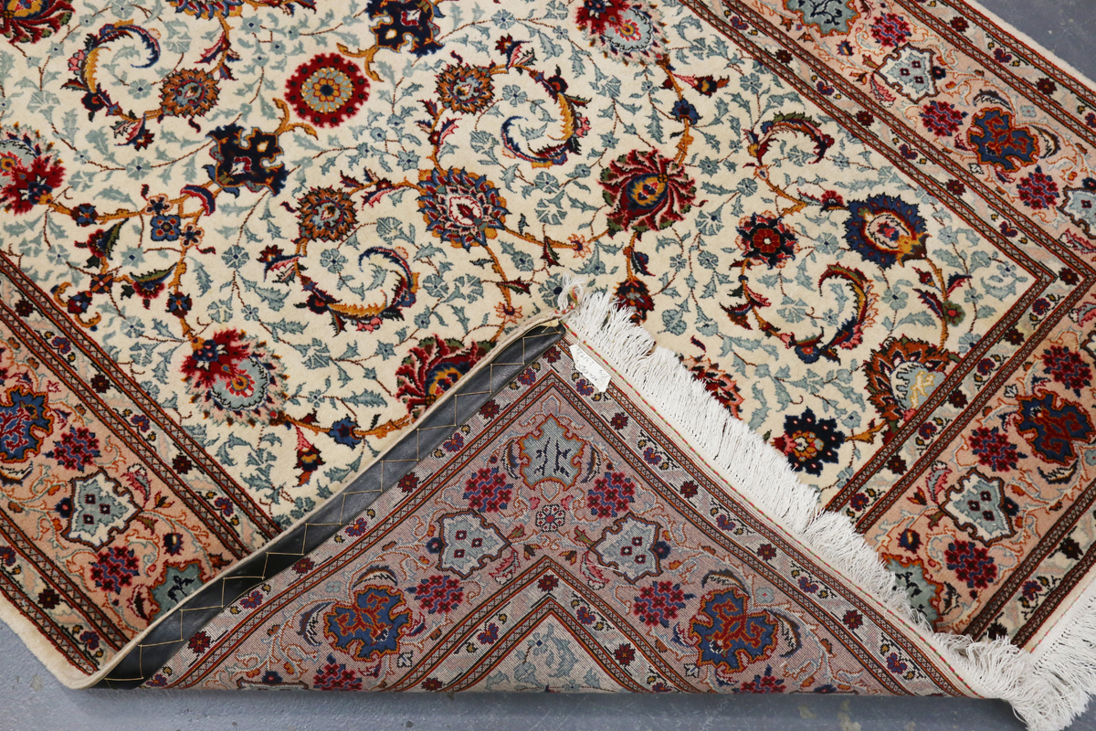 A Tabriz rug, Central Persia, late 20th century, the ivory field with overall scrolling tendrils - Image 2 of 6