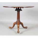 A George III mahogany tip-top supper table with later carved base, the birdcage mount above a fluted