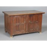 An early 20th century Arts and Crafts oak low two-door cupboard, height 69cm, width 120cm, depth