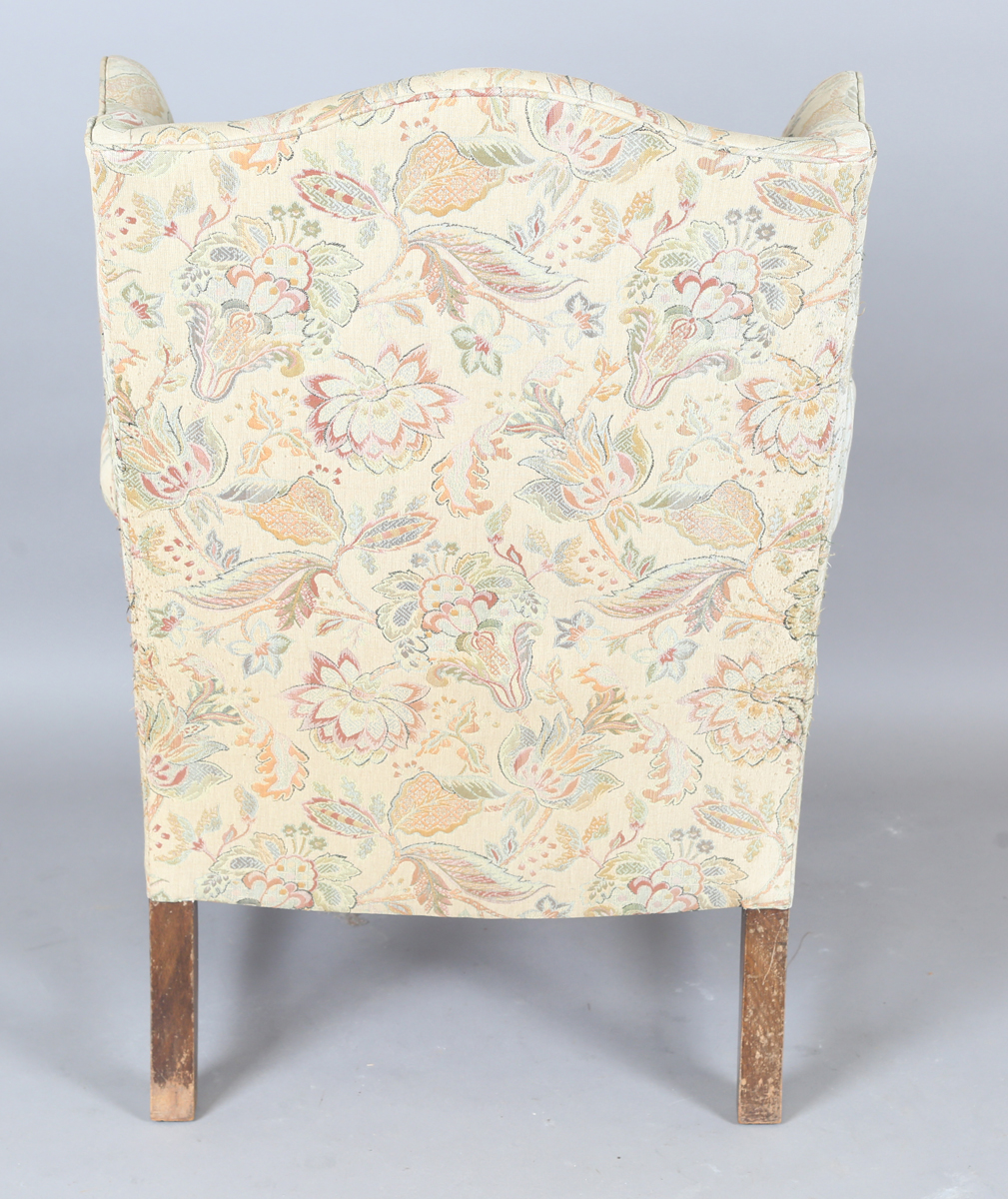 A 20th century George III style wingback armchair, upholstered in foliate machined tapestry style - Image 4 of 12