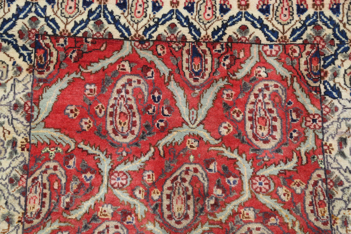 A Tabriz rug, Central Persia, mid/late 20th century, the red field with a boteh lattice, within an - Image 5 of 6