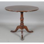 A late George III mahogany circular tip-top supper table, on tripod legs, height 71cm, diameter