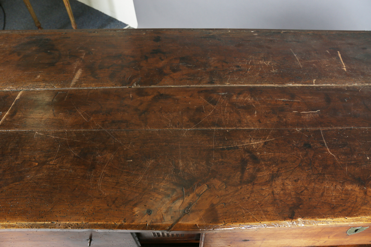 An 18th century French provincial walnut cabinet, fitted with two drawers above panelled doors, - Image 19 of 20