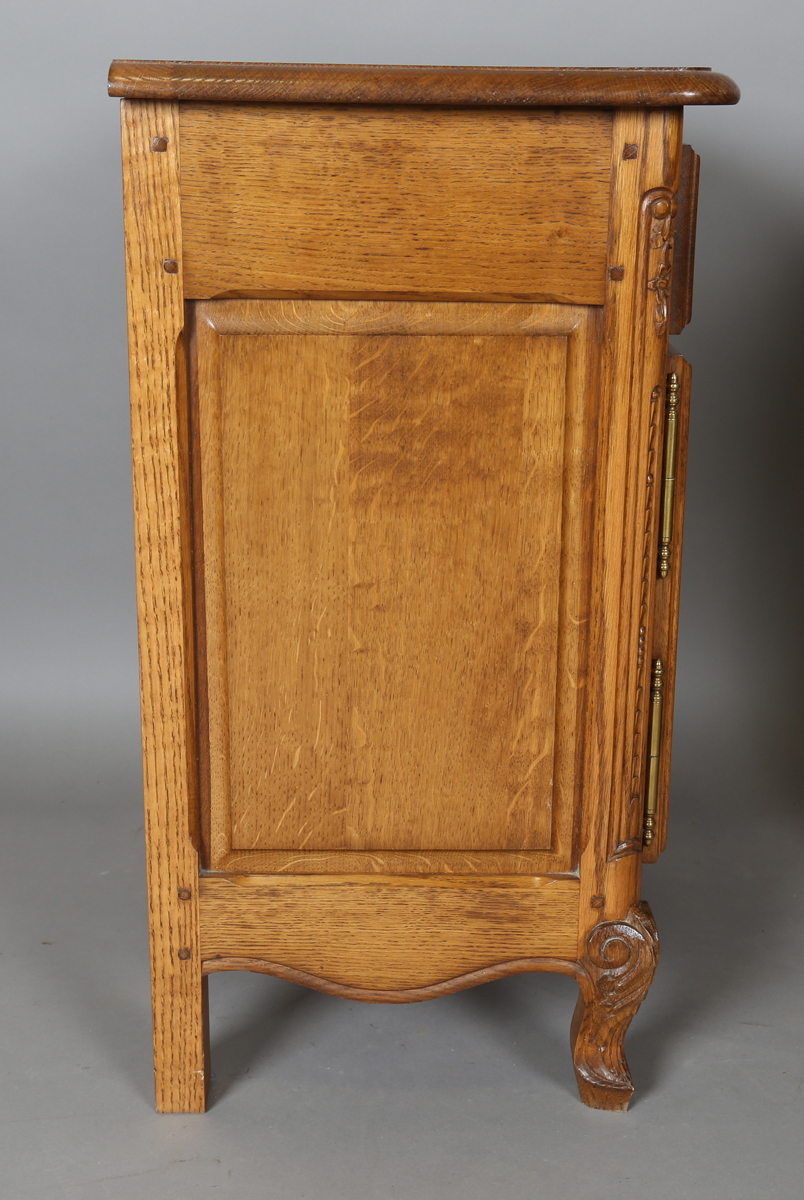 A pair of late 20th century French oak bedside cabinets, each fitted with a finely carved drawer and - Image 13 of 17