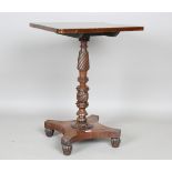 A Regency mahogany and rosewood tip-top reading table, the finely carved stem raised on a quatrefoil