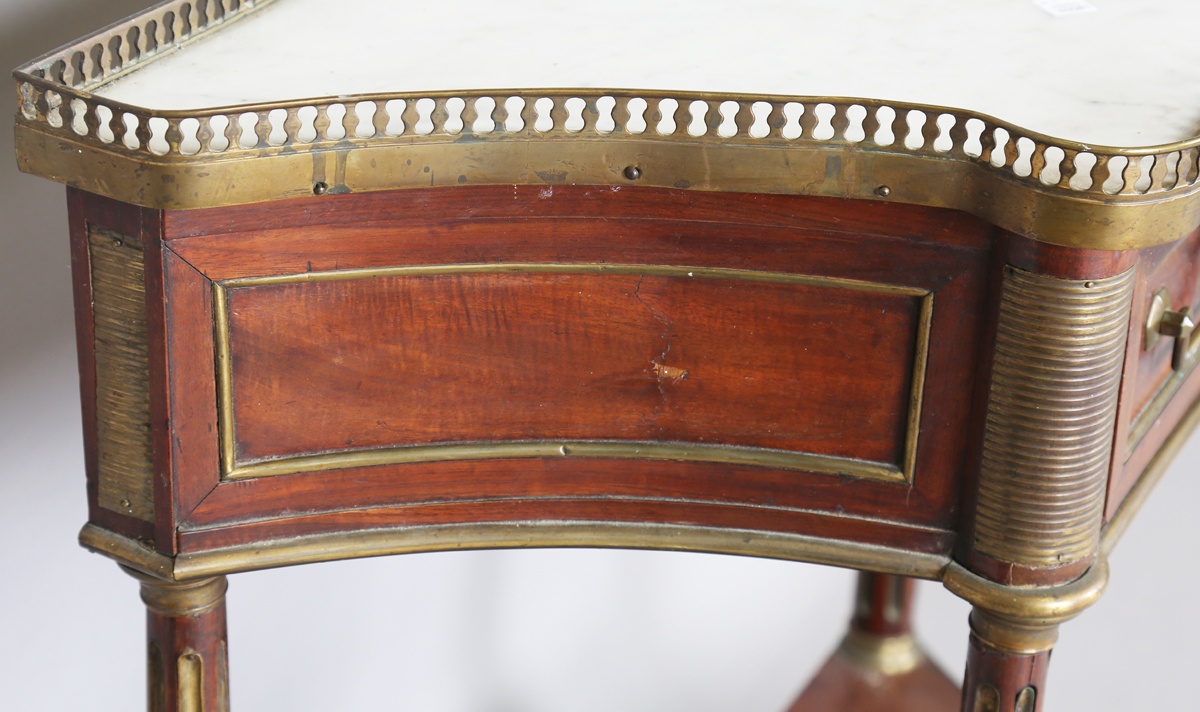 A French Empire mahogany and gilt metal mounted console table, the shaped top inset with white - Image 15 of 20