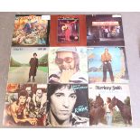 A collection of approximately one hundred LP records, including albums by David Bowie and Elton