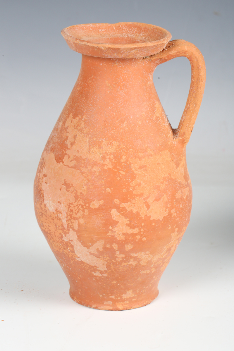 A Roman red ware jug, 2nd-3rd century AD, height 20cm, together with a Roman grey ware twin- - Image 15 of 20
