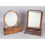 A George III mahogany swing frame mirror, the shaped base fitted with three drawers, height 62cm,