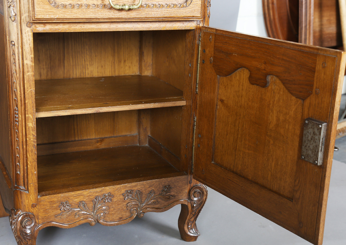 A pair of late 20th century French oak bedside cabinets, each fitted with a finely carved drawer and - Image 6 of 17